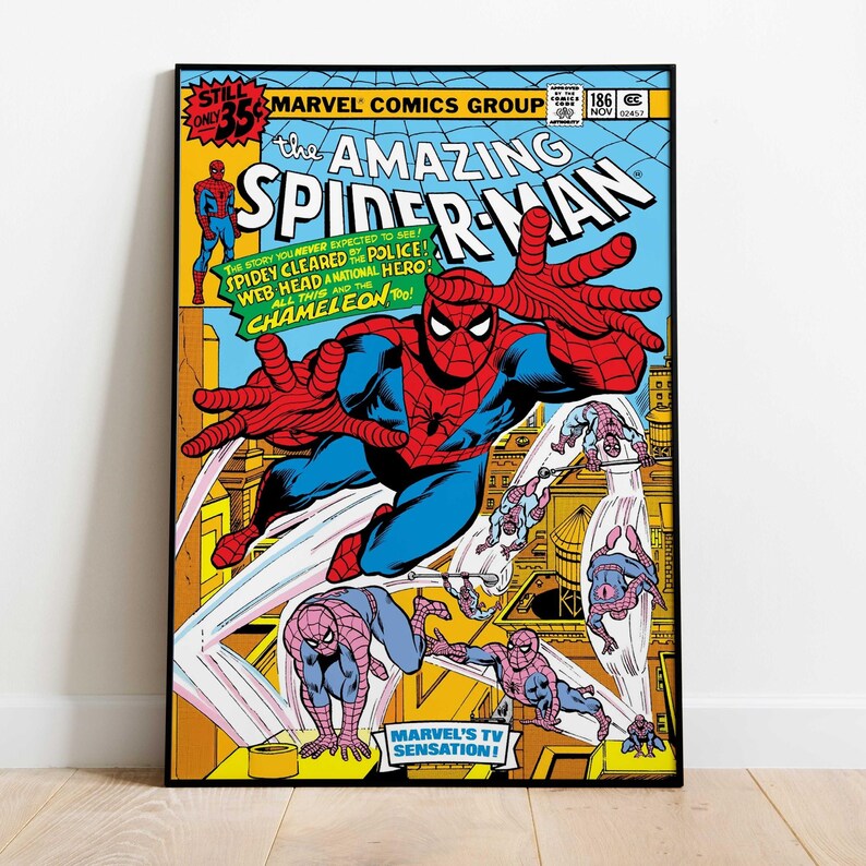 May include: A framed comic book cover of The Amazing Spider-Man. The cover features Spider-Man in a dynamic pose with outstretched hands, set against a cityscape. Bold text includes "Marvel Comics Group" and "The Amazing Spider-Man". The color palette is vibrant with red, blue, yellow, and black.