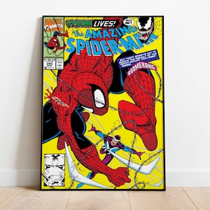 May include: Comic book cover art featuring Spider-Man in a dynamic pose, with the text "VENOM LIVES!" and "THE AMAZING SPIDER-MAN." The artwork has a yellow background with action lines and a villain. The comic is framed in black.
