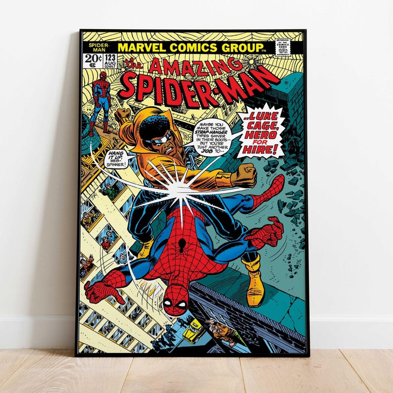 May include: A framed comic book cover featuring Spider-Man in action. The cover art shows Spider-Man fighting another character, with text bubbles and the title "Amazing Spider-Man." The color palette includes red, blue, yellow, and black.
