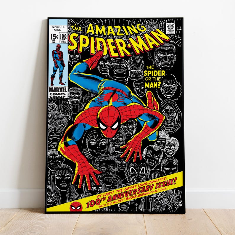 May include: Comic book cover featuring Spider-Man in a red and blue suit, with the title "The Amazing Spider-Man." The background is black with white illustrations of faces. Text includes "100th Anniversary Issue!"