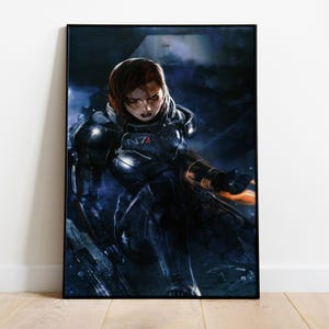 May include: A framed print featuring a female character in futuristic armor, set against a dark, dramatic background. The character has red hair and is in a dynamic pose. The armor has the letters "N7" on it. The overall color scheme is dark with blue and orange highlights.