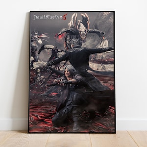 May include: A framed poster for "Devil May Cry 5", showcasing action scenes with characters in dark clothing. The artwork has a red and grey colour scheme, with the game's title displayed at the top. The poster is framed in black.