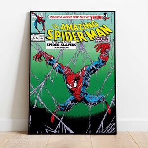 May include: A framed comic book cover featuring Spider-Man in a dynamic pose, entangled in webs against a green background. The title "The Amazing Spider-Man" is prominently displayed, with text indicating "Invasion of the Spider-Slayers".