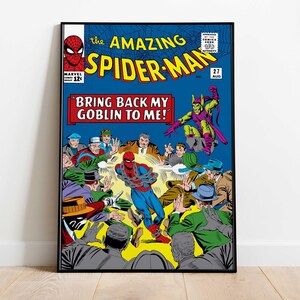 May include: A framed vintage comic book cover of The Amazing Spider-Man #27. The cover features Spider-Man in a blue and red suit, bound by chains, surrounded by people. The text reads "BRING BACK MY GOBLIN TO ME!"