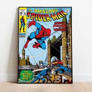 May include: A framed comic book cover featuring Spider-Man in a dynamic pose against a London backdrop. The title reads "The Amazing Spider-Man" with additional text "Spidey Fights in London!" and "The Hostage Must Die!" in a vintage comic book style.