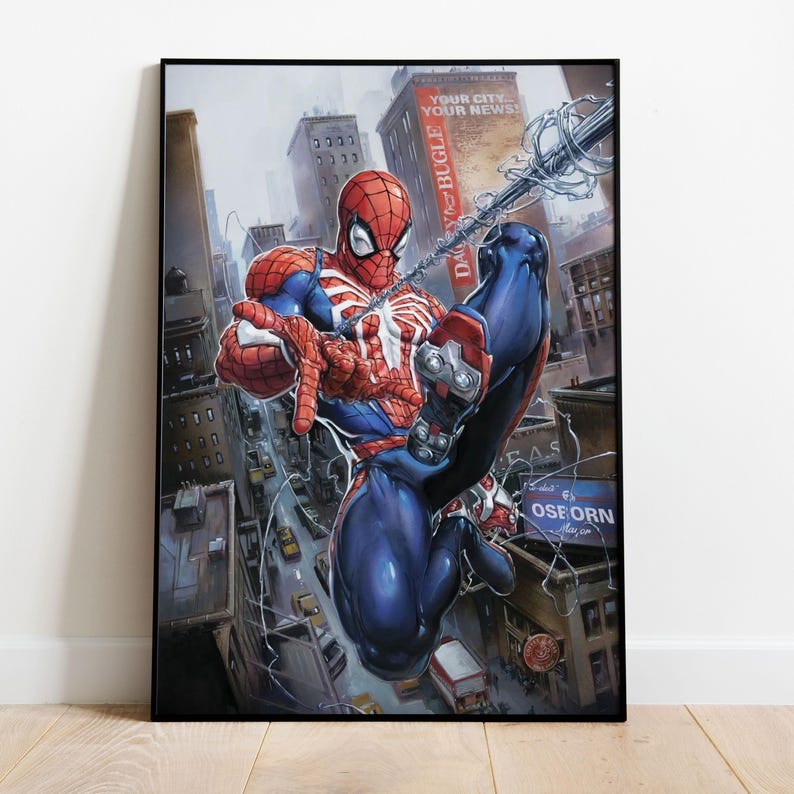 May include: Framed artwork featuring Spider-Man in a dynamic pose, swinging through a city. The superhero is depicted in his classic red and blue suit, with web lines extending across the cityscape. The Daily Bugle sign is visible.