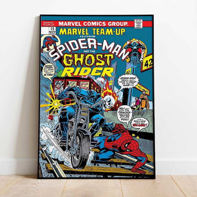 May include: A framed comic book cover featuring Spider-Man and Ghost Rider. The cover art is in vibrant colours, with Spider-Man in a red and blue suit and Ghost Rider on a motorcycle. Text includes "Marvel Team-Up" and "Marvel Comics Group."