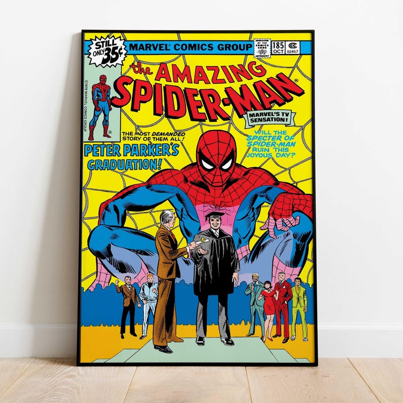 May include: A framed comic book cover of The Amazing Spider-Man. The cover features Spider-Man in a red and blue suit, with text that reads "Peter Parker's Graduation!" and "Marvel Comics Group". The background is yellow with a spiderweb design.