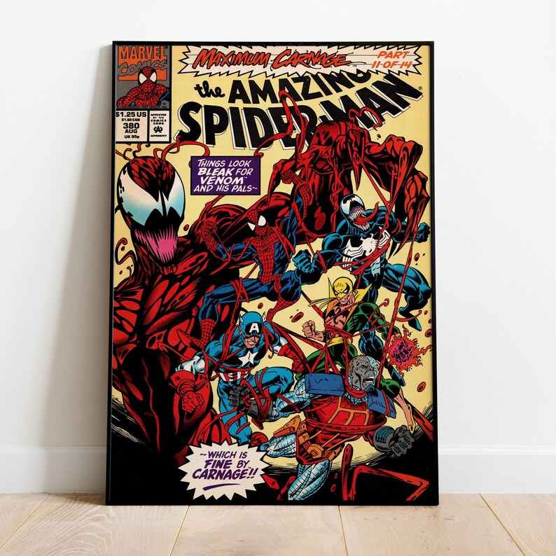 May include: Comic book cover art featuring Spider-Man, Venom, and Carnage in a dynamic action scene. The title "The Amazing Spider-Man" is prominently displayed, with text that reads "Things look bleak for Venom and his pals." The artwork is framed in black.