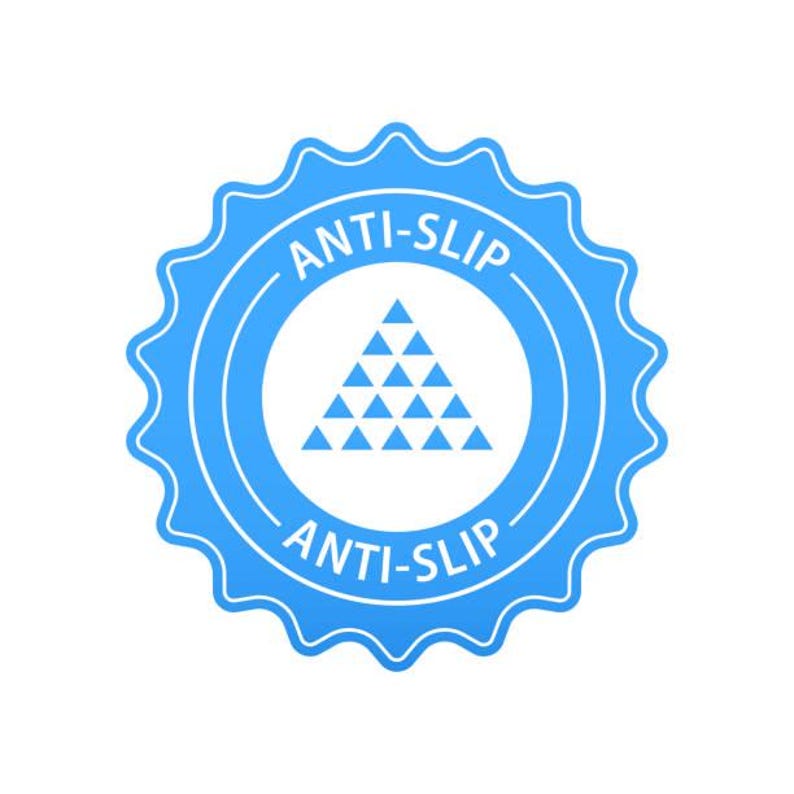 May include: A blue and white anti-slip sticker. The sticker has a circular design with a jagged edge. The words "ANTI-SLIP" are written in white, curved around the top and bottom of the circle. Inside the circle is a white triangle made of smaller triangles.