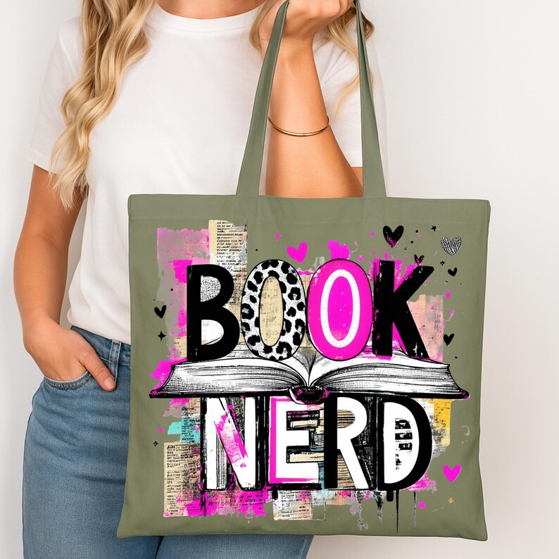 May include: An olive green tote bag with the words "BOOK NERD" in a bold, colorful design. The word "BOOK" features a leopard print "O", and the word "NERD" is in white. The design includes an open book and pink accents.