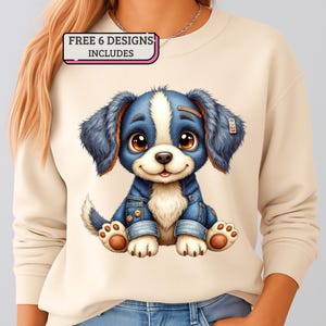 May include: Cream-colored sweatshirt featuring a cartoon puppy wearing a denim jacket. The puppy has blue ears and a white stripe on its head. The text "FREE 6 DESIGNS INCLUDES" is in a pink and white box.