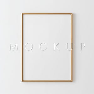 May include: A rectangular gold frame with a white interior, set against a white backdrop. The word "MOCKUP" is displayed in white, centered within the frame. The frame is empty, ready for artwork or a photograph.