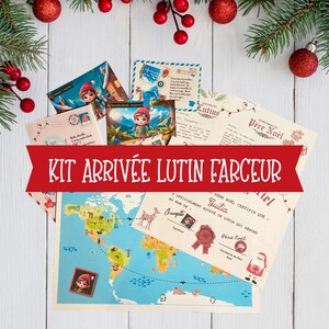May include: A Christmas-themed kit featuring postcards, a world map, and a certificate. The kit includes a red banner with the text "KIT ARRIVÉE LUTIN FARCEUR". The scene is decorated with pine branches, red berries, and baubles.