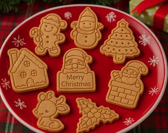 May include: A red plate with an assortment of gingerbread cookies in various Christmas shapes. The cookies include a gingerbread man, snowman, Christmas tree, house, Santa Claus with a sign that says "Merry Christmas", reindeer, and holly.