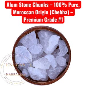 May include: A wooden bowl filled with translucent, irregularly shaped alum stone chunks. The text at the top reads "Alum Stone Chunks - 100% Pure, Moroccan Origin (Chebba) - Premium Grade #1". A circular logo with text is at the bottom.