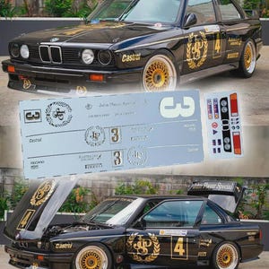 May include: Black BMW E30 race car with gold accents and the text "John Player Special." The car features gold wheels, sponsor decals, and the number 4. A sheet of decals is in the foreground.