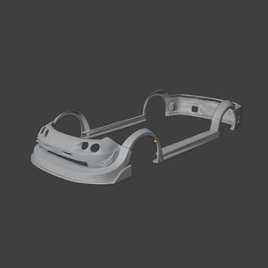 May include: A light grey 3D digital model of a vehicle body kit, featuring a front bumper with integrated air intakes, side skirts, and rear wheel arch extensions. The structure is rendered in a neutral tone with smooth, clean surfaces.
