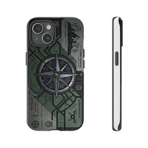 May include: A black and white phone case with a compass design. The case has a green and black camouflage pattern with the words "Future peaks" and "CYBER-VEHICLE" printed on it. The compass has a blue glow.
