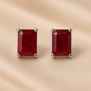 Red ruby silver stud earrings close-up