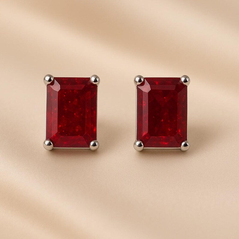 Red ruby silver stud earrings close-up