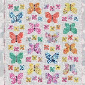 May include: A quilt pattern titled "Flutterby" featuring a repeating butterfly design in various colors, including blue, orange, pink, and green, on a light gray background. The words "Fat Quarter Friendly" are also visible.