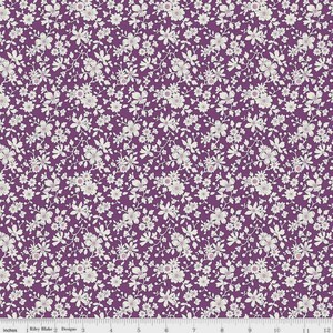 May include: A fabric with a repeating floral pattern. The design features small, off-white flowers with pink centers and green stems against a deep purple background. The fabric is measured in inches.
