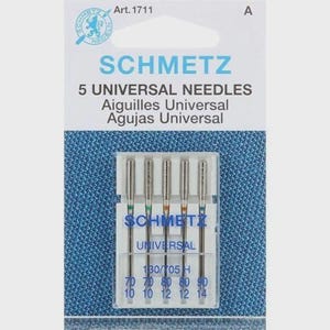May include: A package of SCHMETZ universal sewing machine needles. The package includes five needles in a clear plastic case. The needles are labeled with sizes 70/10, 80/12, and 90/14. The package has the text "SCHMETZ" and "UNIVERSAL NEEDLES".