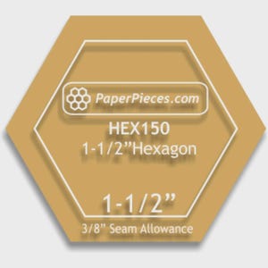 May include: A golden-brown hexagon-shaped product label with white text and outlines. The label reads "PaperPieces.com", "HEX150", "1-1/2" Hexagon", "1-1/2"", and "3/8" Seam Allowance". The hexagon measures 1.5 inches.
