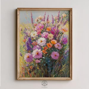 May include: A framed floral painting featuring a vibrant bouquet of colorful flowers. The artwork showcases a variety of blooms in shades of pink, purple, orange, and white, set against a backdrop of green foliage and a light blue sky. The frame is a warm gold color.