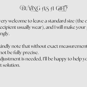 May include: Text on a light gray background reads "BUYING AS A GIFT?" followed by instructions about sizing for gifts. The text advises leaving a standard size and notes that without exact measurements, the fit may not be precise.
