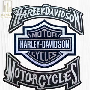 May include: Three Harley-Davidson patches. The top patch reads "HARLEY-DAVIDSON" in white script on a black banner. The center patch is a shield with "MOTOR HARLEY-DAVIDSON CYCLES" in white lettering on a navy blue background. The bottom patch reads "MOTORCYCLES".