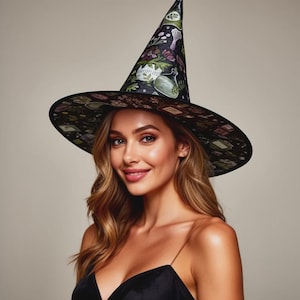 May include: A pointed witch hat featuring a black base with a colourful botanical and potion bottle print. The design includes illustrations of green glass bottles, purple flowers, and various herbs scattered across the fabric of the tall cone and wide brim.