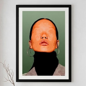 May include: A framed art print featuring a portrait of a person with an orange-toned face and a black turtleneck. The background is a muted green. The person is wearing large silver hoop earrings. The artwork is displayed above a wooden bench.