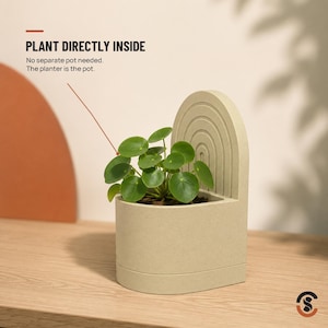 A light beige bookend planter with a small green plant, with text overlay "PLANT DIRECTLY INSIDE No separate pot needed. The planter is the pot."