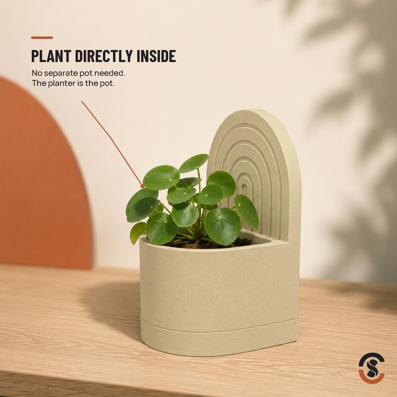 A light beige bookend planter with a small green plant, with text overlay "PLANT DIRECTLY INSIDE No separate pot needed. The planter is the pot."