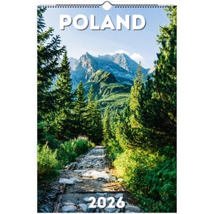 May include: A 2026 calendar featuring a scenic view of Poland. The image showcases a stone path winding through a lush green forest, leading towards towering mountains under a clear blue sky. The word "POLAND" is at the top.