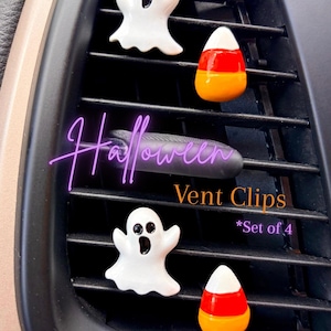 May include: A set of four Halloween vent clips featuring two white ghosts with black eyes and mouths and two candy corn pieces with white, orange, and yellow stripes. The text Halloween Vent Clips *Set of 4 is overlaid on the image.
