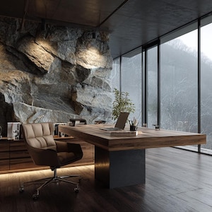 May include: A modern office space with a large wooden desk, a leather chair, and a laptop. The room features a stone wall and a large window with a view of a misty mountain range. The interior design is minimalist and luxurious.