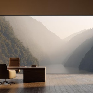 May include: A modern office space with a large window overlooking a mountain range and a river. The room features a wooden desk, a swivel chair, and a stone wall. The natural light creates a warm and inviting atmosphere.