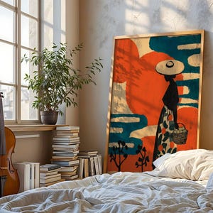a bedroom with a bed, a potted plant, a large painting of a woman, and a stack of books.
