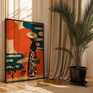 a large framed painting of a woman in a colorful dress and hat, standing in front of a window with a palm tree in a black pot. The painting is placed on a wooden floor, and there is a beige curtain in the background.