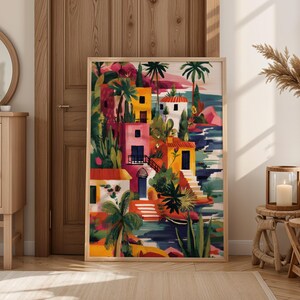 a vibrant, colorful painting of a tropical village, with palm trees, buildings, and water, displayed in a room with a wooden door and a mirror.