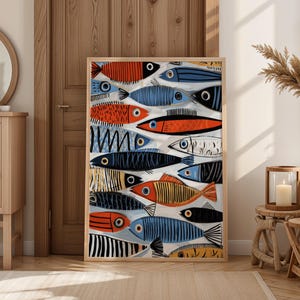 a large, colorful painting of fish displayed in a room with a wooden door and a mirror.