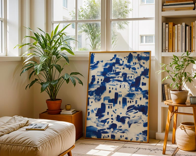 a cozy living room with a large blue and white abstract painting on the wall, a comfortable sofa, a wooden side table, and several potted plants.