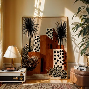 a living room with a large framed artwork depicting a tropical city scene with palm trees and buildings, a lamp, a record player, and a potted plant.