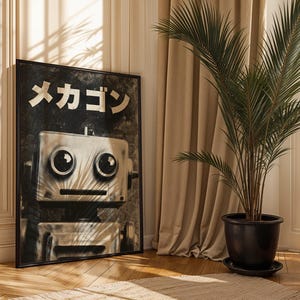 a large black and white poster of a robot with a face, placed on a wooden floor next to a potted plant.