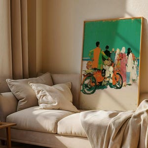 a large, colorful painting of people on a motorcycle displayed on a wall in a living room.