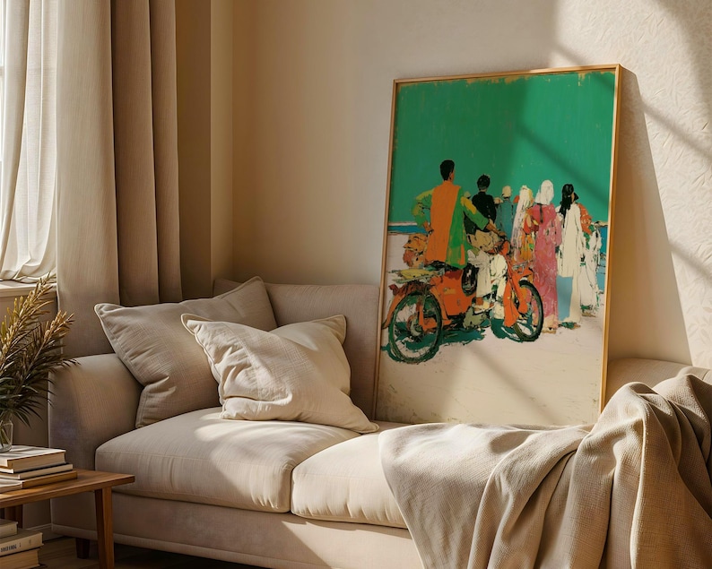 a large, colorful painting of people on a motorcycle displayed on a wall in a living room.