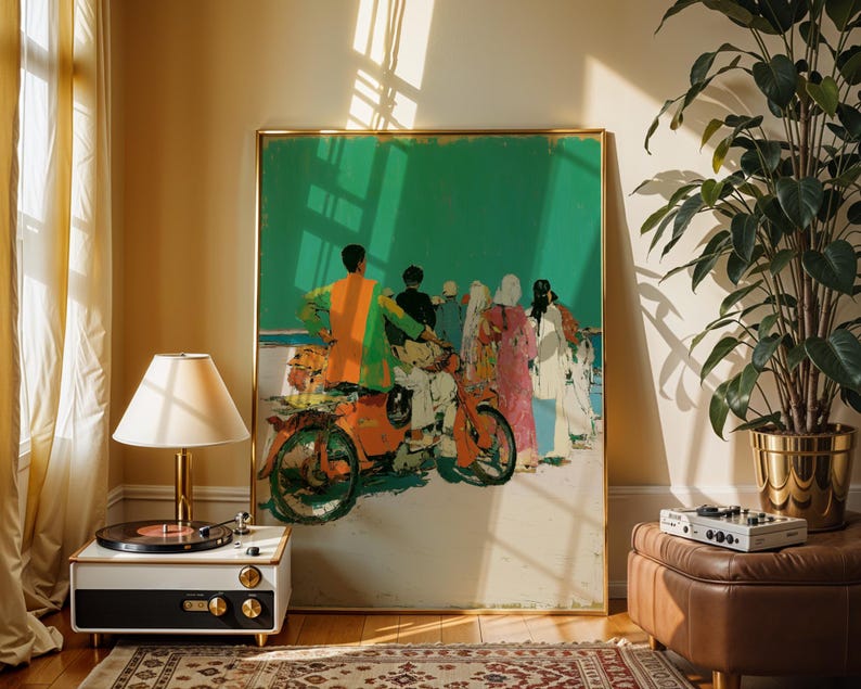 a large framed painting of a group of people on a motorcycle, with a vintage-style lamp and a potted plant in the foreground.